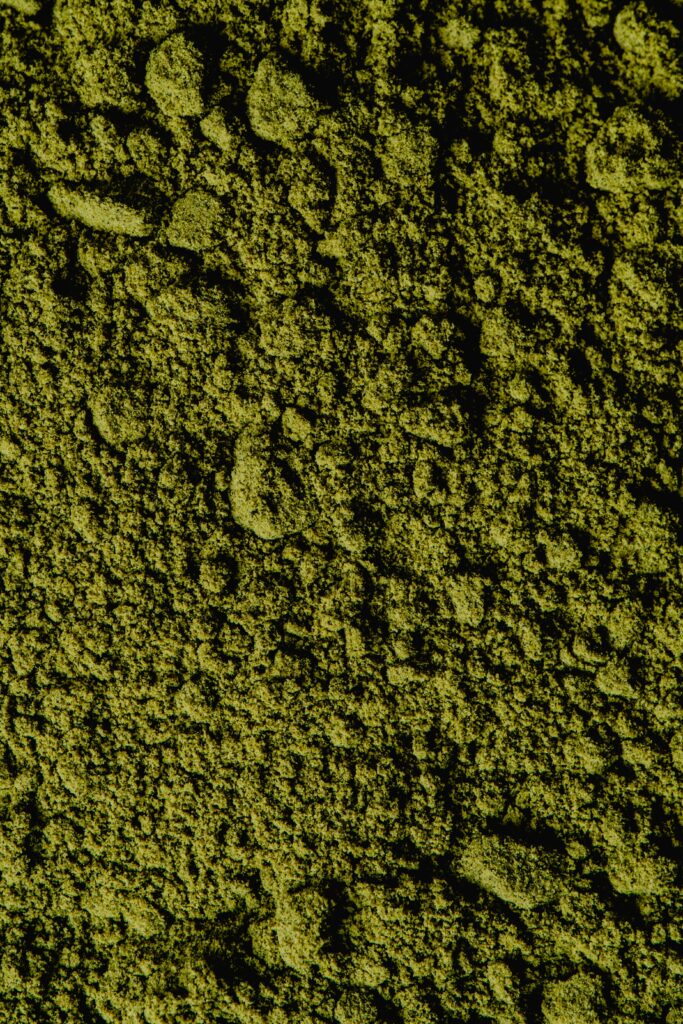 Closeup view of coarse green matcha powder texture.